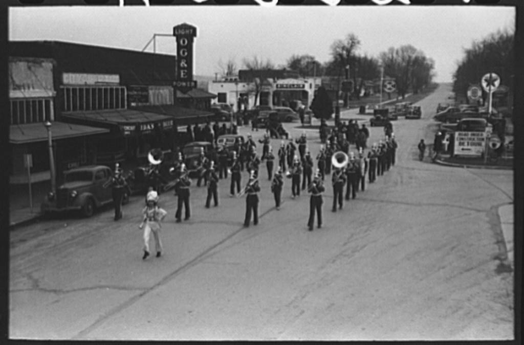 Historical photograph: High school band parading down the main street of Eufaula, Oklahoma